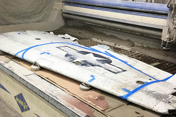 Koss Industrial cuts a jet wing with a waterjet